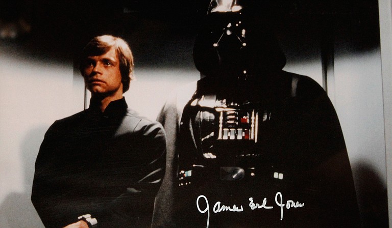The villainous Darth Vader (pictured with Luke Skywalker, left, and him in "Star Wars Episode VI: Return of the Jedi" in a print signed by Mississippi native James Earl Jones, who did the voice work for Vader in the original trilogy. The photo hangs in The Iron Horse Grill's "Mississippi Music Experience" museum.) remains a driving factor in the latest installation of the "Star Wars" franchise, "The Force Awakens," which opens Friday, Dec. 18.