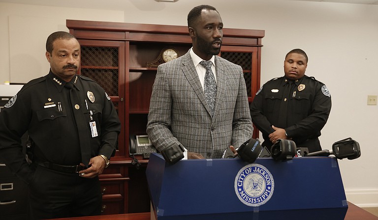 The City of Jackson announced several more firings of workers, and up to two arrests, for water-related theft on Dec. 18. Mayor Tony Yarber (center) announced arrests of two public-works employees earlier in the week. Chief Lee Vance (far left) commended Commander Tyrone Buckley (far right) and Sgt. Obie Wells (not pictured) for leading the investigation.