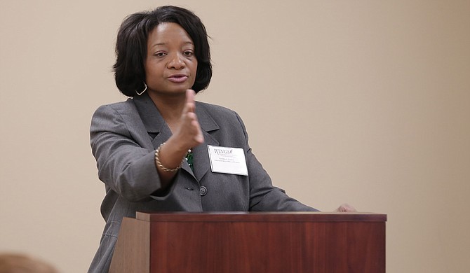 Ta’Shia Gordon, a deputy director with the Mississippi Administrative Office of the Courts, speaks at the Mississippi Working Interdisciplinary Networks of Guardianship Stakeholders Committee at the Mississippi Supreme Court on Dec. 11.