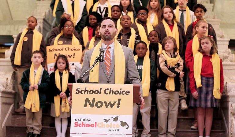 Grant Callen, president of Empower MS and a strong supporter of vouchers and charter schools, speaks to the crowd gathered at the Capitol for the National School Choice Week rally on Tuesday.