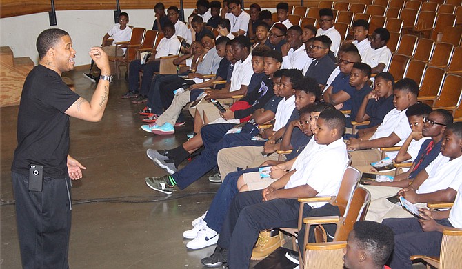 Tommie Mabry, who was kicked out of Whitten Preparatory Middle School more than a decade ago, told young men there to let music like that of Lil Boosie be the “passion of your ear, not your lifestyle.” Photo courtesy Jackson Public Schools