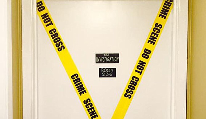 In The Investigation's scenario, players discover that a friend has been found dead in her dorm room. The police never caught the killer, so the team must take matters into their own hands. The goal is to find out who the killer is and escape before he strikes again. Photo courtesy JXN Escape Room