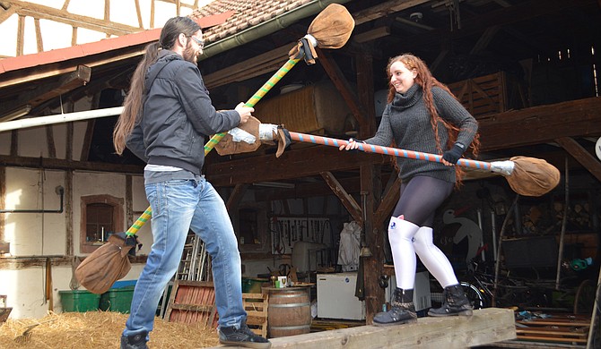 Alexandre (left) and Heather Berthereau (right) play with pugil sticks at a medieval festival. Photo courtesy Richard Coupe