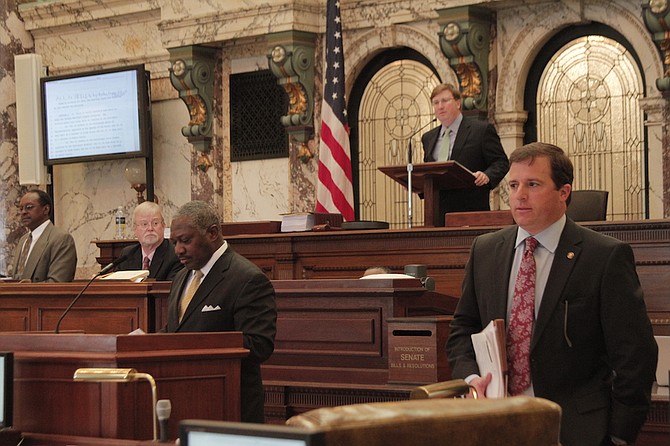 Senator John Horhn (left) offered five amendments to the "airport takeover" bill authored by Senator Josh Harkins (right) before it passed the Senate on March 3, 2016.