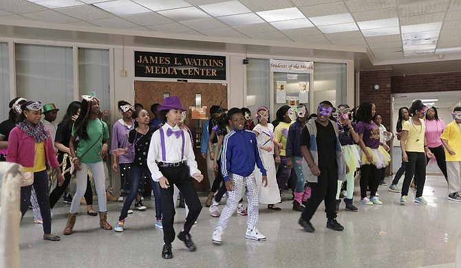 Northwest IB Middle School students dance to Mardi Gras music.