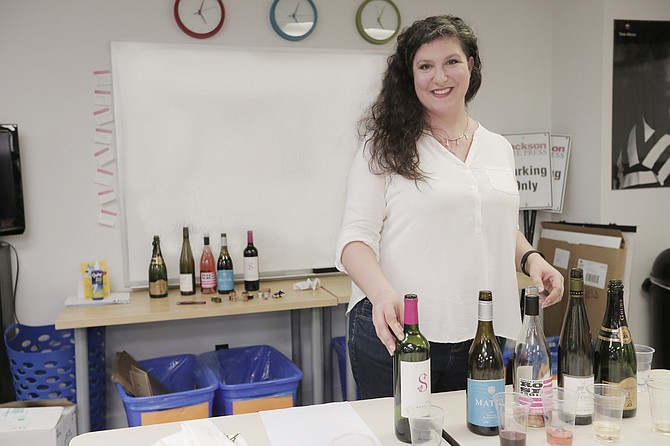 Briarwood Wine & Spirits Store Manager Laura Collins, who is also a certified sommelier, introduced JFP staffers to the wines in the newspaper’s recent wine tasting.