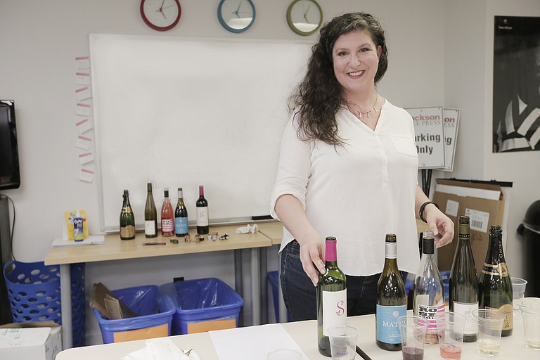 Briarwood Wine & Spirits Store Manager Laura Collins, who is also a certified sommelier, introduced JFP staffers to the wines in the newspaper’s recent wine tasting.