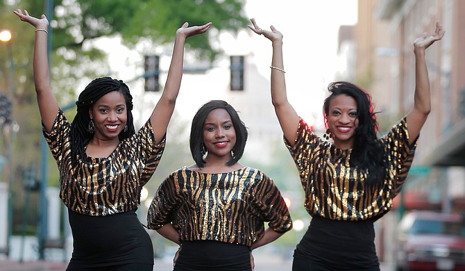 (Left to right) Amira Carey, Elisha Roberts and Monica T. Shepherd perform as Motown-inspired singing trio Love Notez.