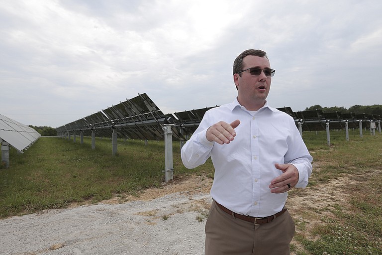 Aaron Hill, manager of transmission planning at Entergy’s solar plant in Hinds County, shows off the panels, which are on a tracking system to follow the Sun.