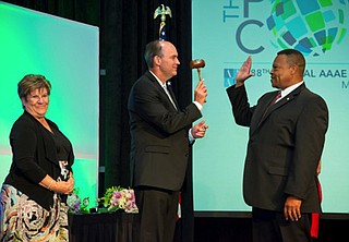 Carl Newman, executive director of the Jackson Medgar-Wiley Evers International Airport, receives the gavel from previous head of the American Association of Airport Executives, Jeff Mulder from Tulsa, Okla. Photo courtesy JMAA