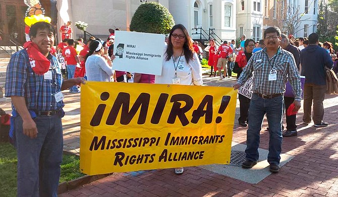 Jesus Mateos Ramirez (left), Melinda Medina (center) and Esequiel Gamboa (right) attend a rally for Immigrants Rights. Medina is the co-owner of the Gulf Coast Latino Services and a community organizer with MIRA. Photo courtesy Melinda Medina