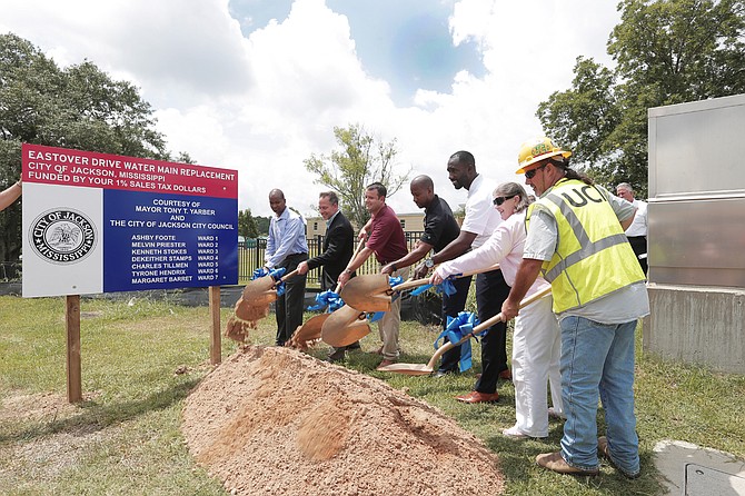Mayor Tony Yarber and other parties associated with the project dug in for the ceremonial ground-breaking for the replacement of the water main on Eastover Drive.