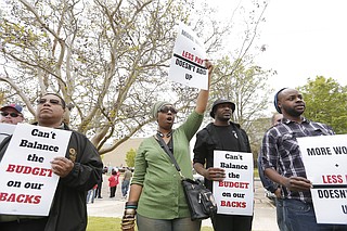 City workers and community activists protested furloughs on April 1, 2016, for municipal employees, which Council President Melvin Priester believes will be in place through next year's budget. File Photo