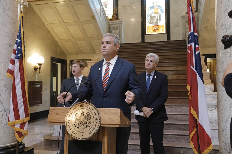 House Speaker Philip Gunn (center), Lt. Gov. Tate Reeves (left) and Gov. Phil Bryant (right) announced last week that working groups of legislators will look at individual state agency budgets as well as the state’s tax code.