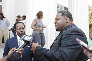 MAC and Associates, LLC, wants to keep its lawsuit against Siemens Industry Inc., in the Hinds County Circuit Court rather than in federal court. Jackson attorney Robert Gibbs (left) is represented owner Marcus Wallace (right) in the case.