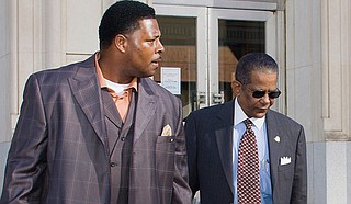 Rev. Robert Earl Henderson Jr. (left) was a long-time supporter of Mayor Frank Melton (right). Here he accompanies the then-mayor from his federal trial in 2009 for destroying a duplex in the Virden Addition with sledgehammers. 