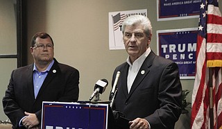 Gov. Phil Bryant told reporters he has a problem with universities taking down the Mississippi state flag because it sends the message to students that universities can ignore the state code.