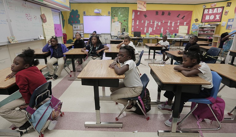 Galloway Elementary School students pay attention to their teacher during afterschool with Operation Shoestring.