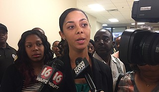 Lilli Evans Bass, attorney for the Mississippi Alliance for State Employees, stands next to Willie Thompson, right, whom the Civil Service Commission recently reinstated.