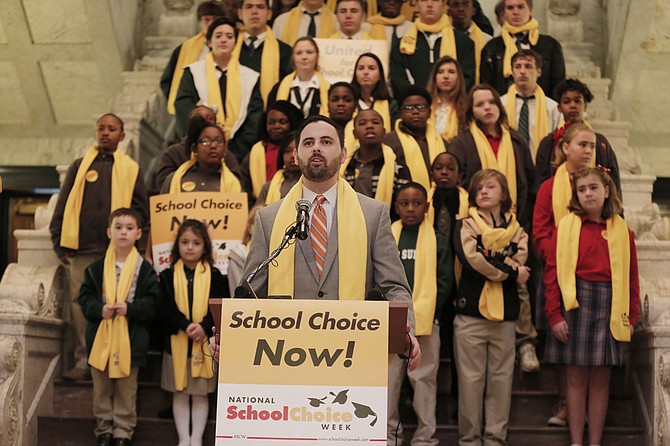 Grant Callen, president of “school choice” advocacy group Empower Mississippi, speaks before a crowd at the Capitol at the beginning of National School Choice Week in February.
