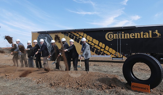 Lawmakers, the governor, Continental executives and break ground on the site of the Continental tire plant outside of Clinton in Hinds County on Nov. 3.