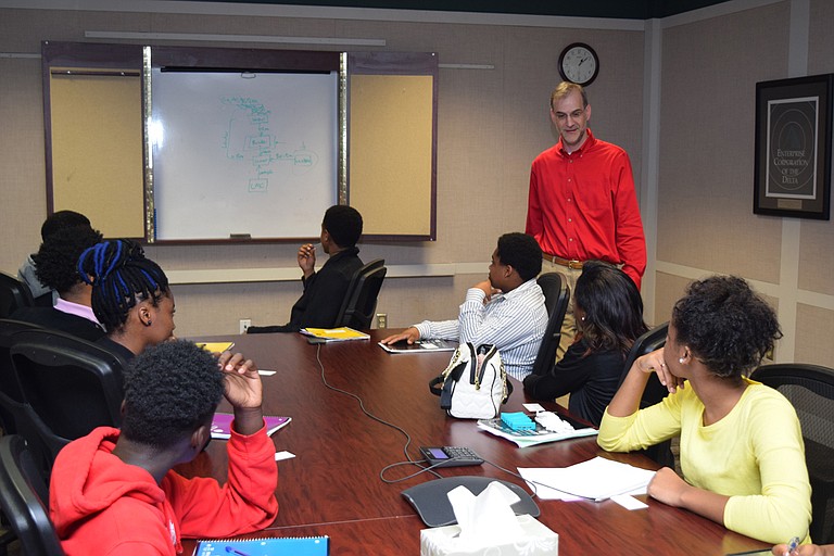 Provine High School students in the Business and Finance Academy listen to Hope Credit Union’s chief financial officer, Richard Campbell, talk about how credit unions work. Photo courtesy Hope Credit Union