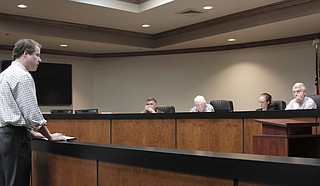 Pearl River Vision Foundation representative Dallas Quinn outlines the next steps in the One Lake project, including meetings with Rankin and Hinds County supervisors, to the Levee Board Monday.