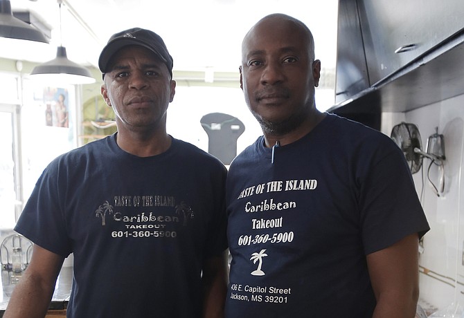 Richard Higgins (right) opened Taste of the Island in June 2009. He is pictured with the restaurant manager, Clayton Brown (left).