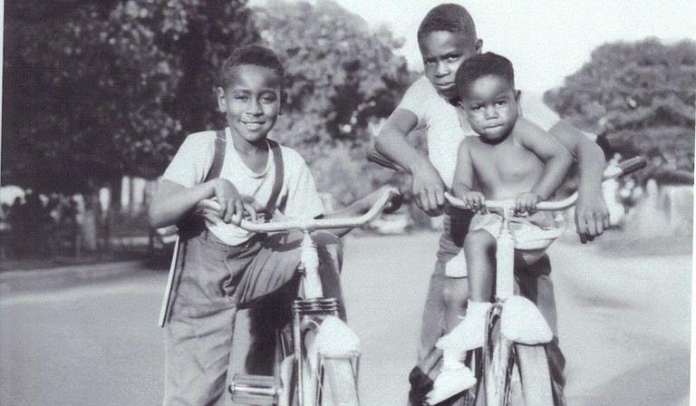 Cousins Emmett Till (left) and Wheeler Parker (back right) wheel around Argo-Summit, Ill., with family friend Joe B. Williams (front right). Parker said this photo was taken some time between 1949-1950. Photo courtesy Wheeler Parker Jr.