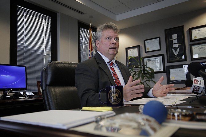 Mississippi Attorney General Jim Hood is suing 25 individuals and companies associated with a prison bribery scheme, saying they should have to repay more than $800 million in revenue they received from the state.