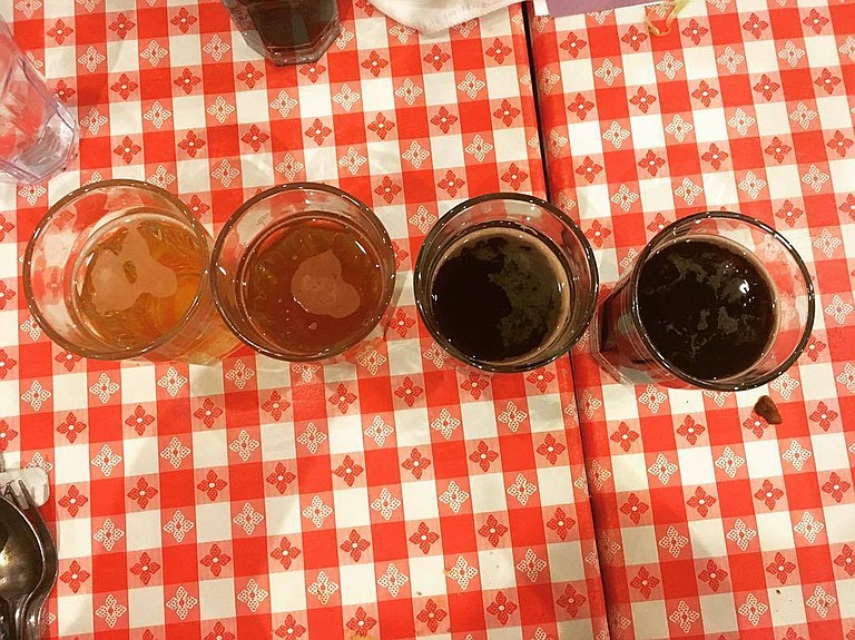 At a Wiseacre Brewing Co. beer dinner on Jan. 30, guests tried Wiseacre beers such as Ananda IPA (far left), Adjective Animal double IPA (center left), Bird Upon a Hippo Belgian stout (center right) and Gotta Get Up to Get Down coffee milk stout (far right).