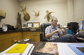 Will Selman, a biology professor at Millsaps College, studies the Ringed Sawback turtle, which can only be found in the Pearl River.