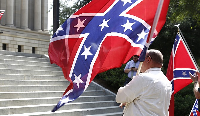 Mississippi is the last state with a flag that includes the Confederate battle emblem — a red field topped by a blue tilted cross with 13 white stars. The state has used the same flag since 1894. Voters chose to keep it in a 2001 election, but it remains a topic of debate in a state with a nearly 38 percent black population.