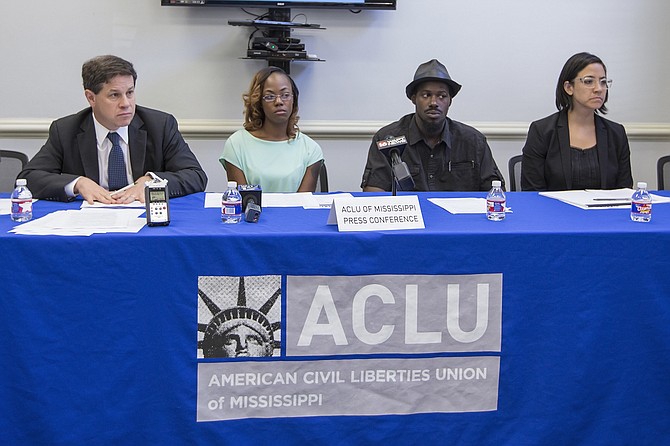  Jonathan Youngwood, attorney at Simpson Thacher & Bartlett (left), plaintiffs Quinnetta Manning and Steven Smith (middle) and ACLU of Mississippi Legal Director Paloma Wu (right) take questions from the press after filing a federal class-action lawsuit against Madison County and Sheriff Randall Tucker.