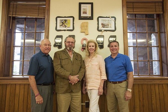 From left: Bill Howard, Mike Flannes, Dawn Flannes and Joe Surkin are members of the Holy Smokers, which is a culinary group based out of St. Andrew’s Cathedral in downtown Jackson.