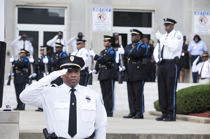 The memorial service program ended with seven officers shooting their ceremonial rifles towards the sky in a 21-gun salute in honor of the fallen officers. 