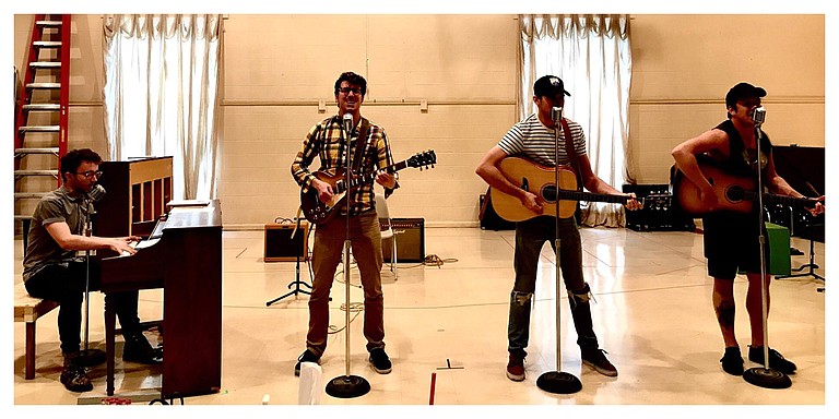 (Left to right) Ian Fairlee, Austin Hohnke, Austin Thomas and Austin Wayne Price during rehearsal. The four star in “Million Dollar Quartet,” which runs May 30-June 11 at New Stage Theatre. Photo courtesy Melissa Tlilman