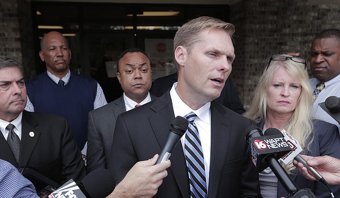 Madison County District Attorney Michael Guest (center) joined County Prosecuting Attorney Pamela Hancock (right) and Hinds County District Attorney Robert Shuler Smith (left) to speak with the media, confirming that they will work together on this case. Guest said that Kingston Frazier's mother, Ebony Archie, was not involved in the kidnapping and murder of her son.