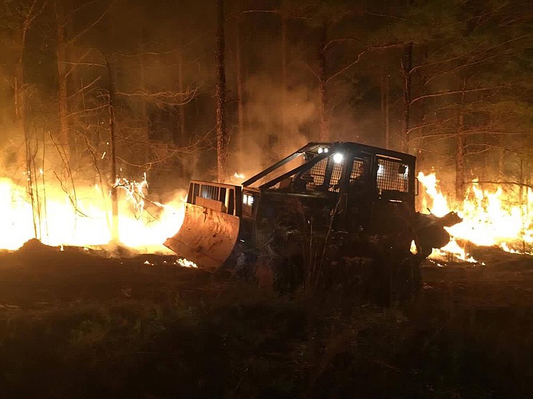 Wildfire season flared this spring; this blaze in Pearl River County in March burned 643 acres and took almost nine hours to contain. Photo courtesy Travis Rubio and MS Forestry Commission