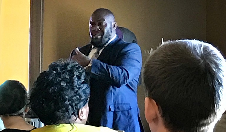 Head of Redeemer's School DeSean Dyson speaks before a crowd at Koinonia Coffee House in Jackson on June 9. Photo courtesy Rachel Fradette