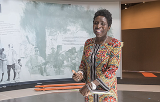 Civil Rights Museum Director Pamela Junior stands in Gallery 3, the "Reflections" room of the state's new Civil Rights Museum on June 27. It and the Museum of Mississippi History opens Dec.9.