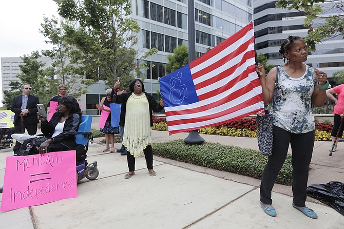 Protesters gathered in front of Sen. Thad Cochran's Jackson office, calling on the senator to vote "no" on the Senate health-care bill, which the Congressional Budget Office said would leave 22 million Americans uninsured by 2026.
