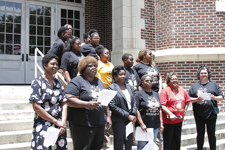 Local Dignity in Schools campaign organizers called on state education officials to prioritize root causes of the state’s achievement gaps in June, as the board approved the state’s Every Student Succeeds Act draft plan inside.