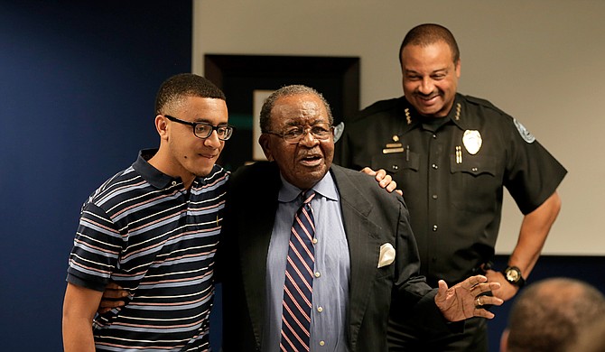 Former Ward 4 Councilman Frank Bluntson acknowledged his grandson Connor Bluntson during his speech after receiving the lifetime achievement award from the Jackson Police Department.