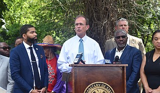 The Secretary of State Delbert Hosemann stands with Mayor Chokwe Antar Lumumba and Senator John Horhn to announce a partnership with Revitalize Mississippi.