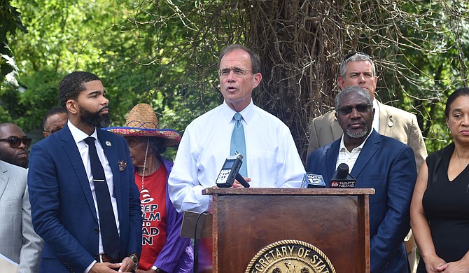 The Secretary of State Delbert Hosemann stands with Mayor Chokwe Antar Lumumba and Senator John Horhn to announce a partnership with Revitalize Mississippi.