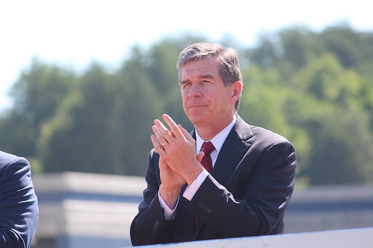 The compromise between Republican legislative leaders and Democrats led by Gov. Roy Cooper (pictured) eliminated a provision that required transgender people to use restrooms in many public buildings corresponding to the sex on their birth certificates. Photo courtesy Flickr/NCDOTcommunications