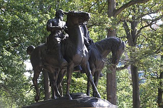 Workers used cranes to lift the towering monument to Robert E. Lee and Thomas J. "Stonewall" Jackson onto a flatbed truck in the dark. Photo courtesy Flickr/Ryan Patterson