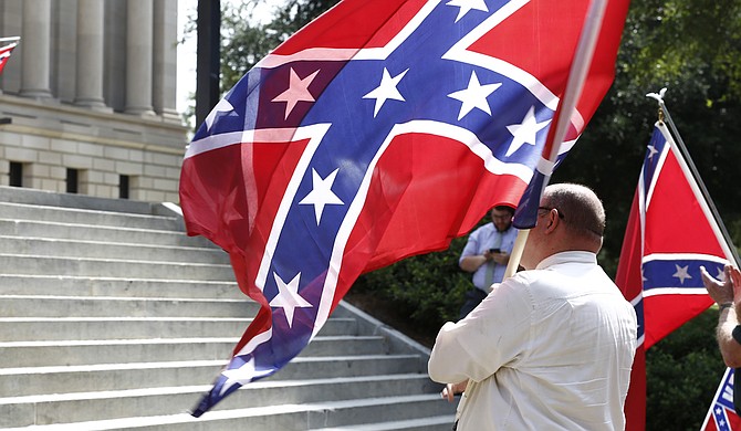 Mississippi has the last state flag featuring the Confederate battle emblem—a red field topped by a blue tilted cross dotted with 13 white stars. The flag has been used since 1894. About two-thirds of the people who voted in the 2001 election voted to keep the design, a margin that roughly reflected the proportion of white to black residents.