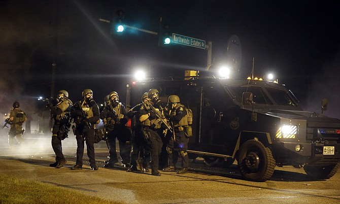 "Three years ago this month, the nation witnessed a highly militarized, violent crackdown by police on protesters in Ferguson. Today's executive order erases the sensible limits placed by the Obama administration after Ferguson on the kinds of military equipment flowing from the federal government to local police and into our neighborhoods." Photo courtesy AP/Jeff Roberson
